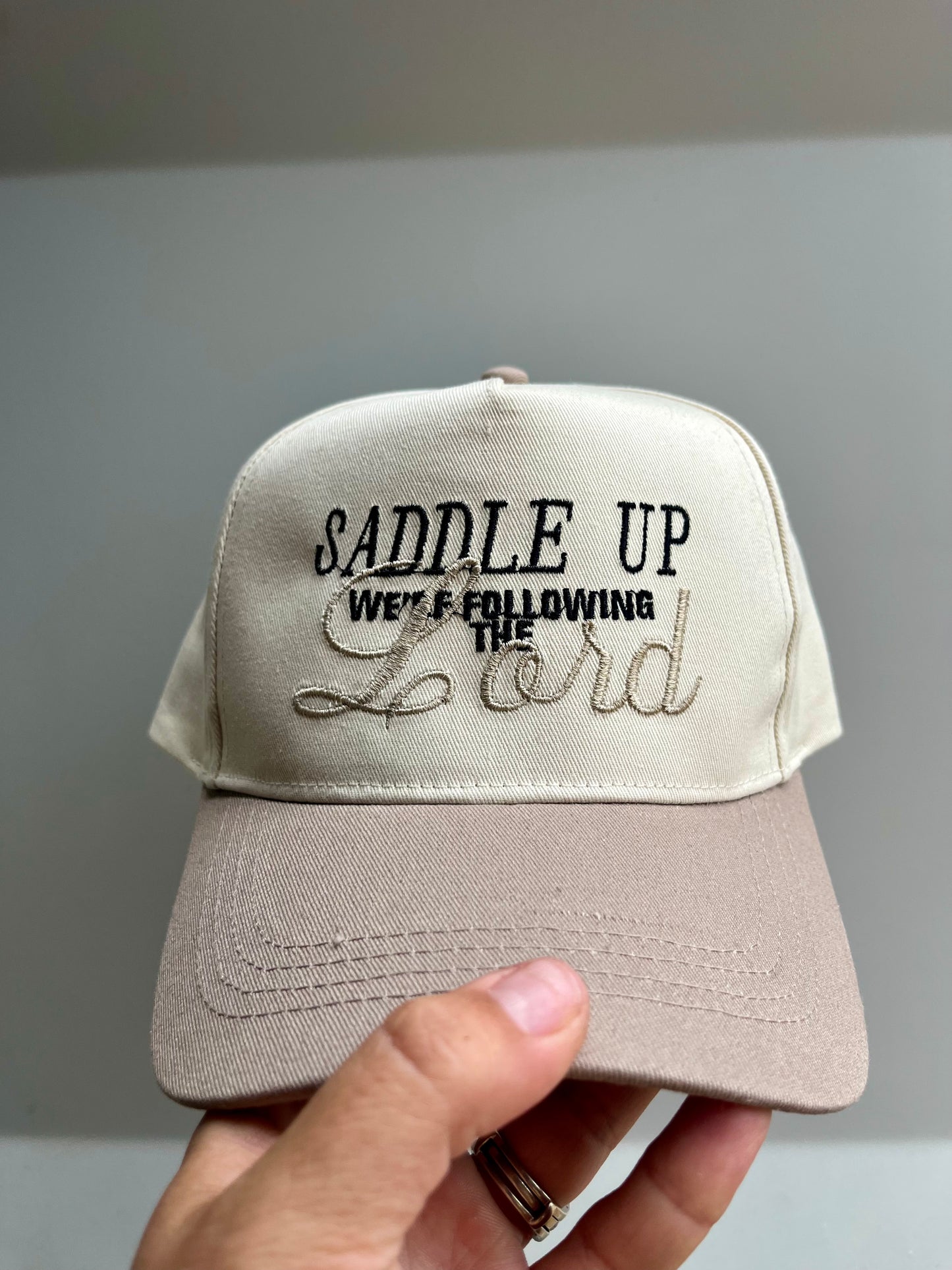 Saddle Up We’re Following The Lord Trucker Hat