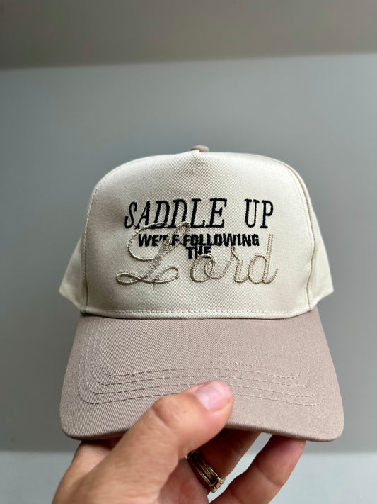 Saddle Up We’re Following The Lord Trucker Hat