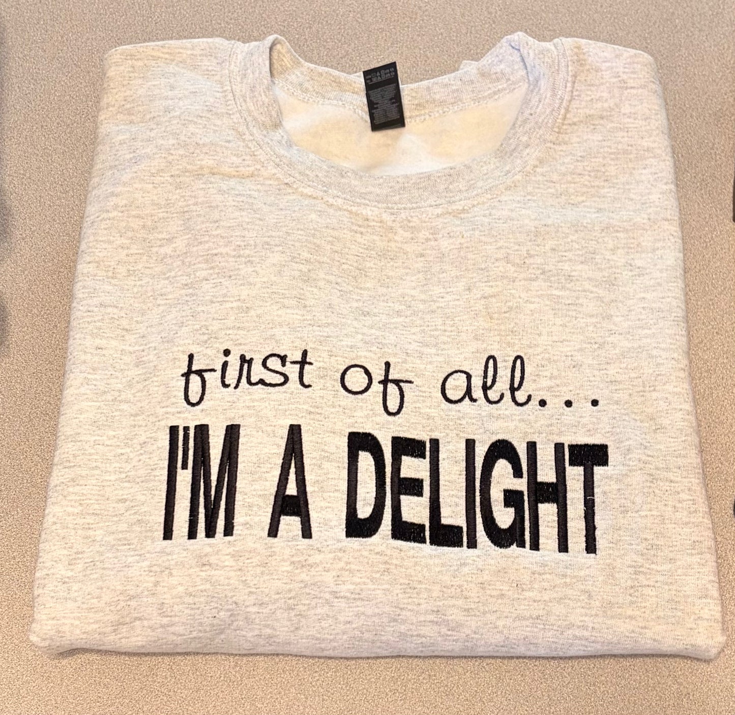 First of all… Embroidered Crewneck